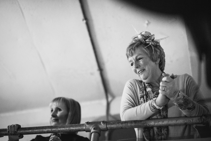 wedding guests watching wedding speeches