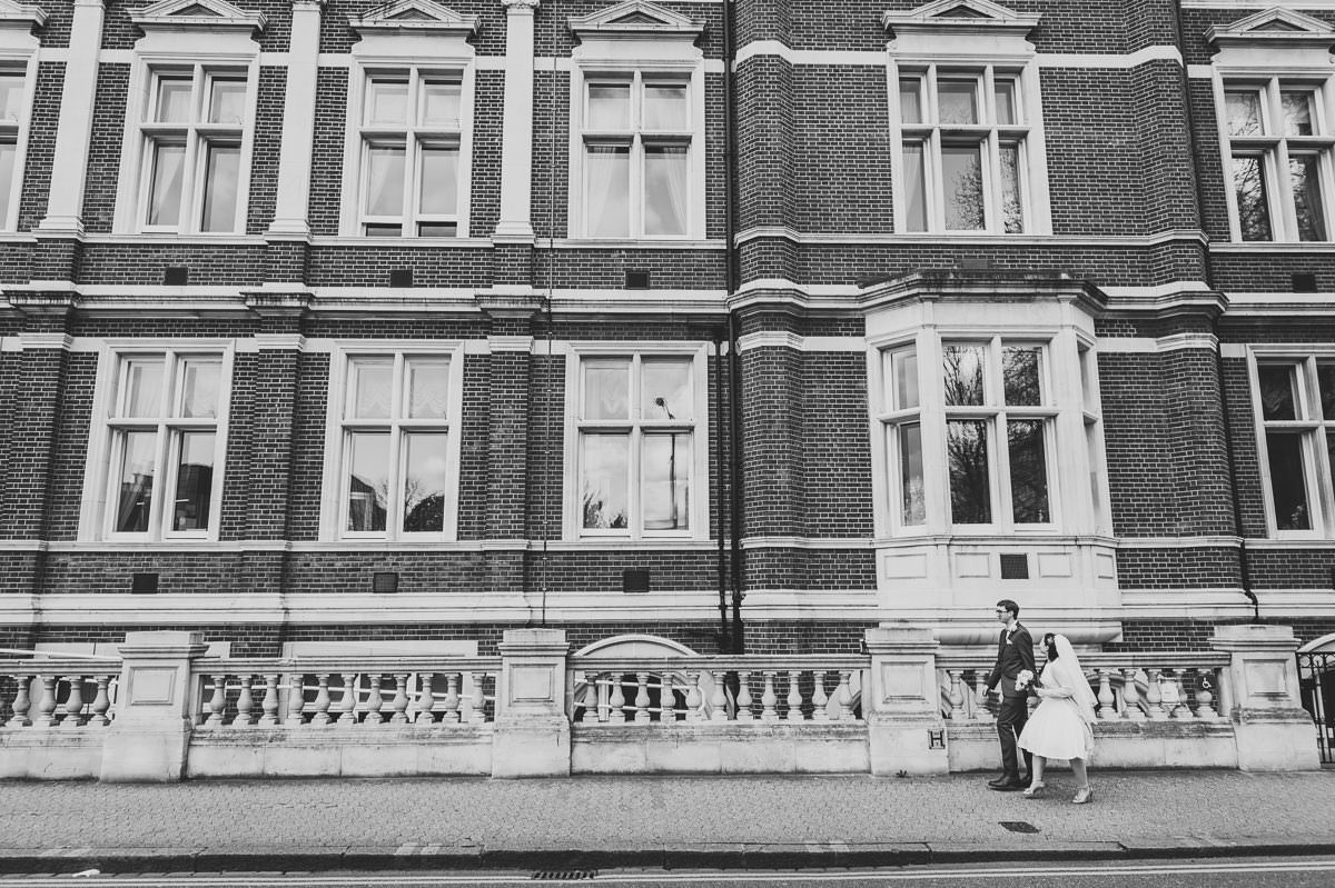 Bride and Groom walking in Croydon after their wedding at the Old Town Hall