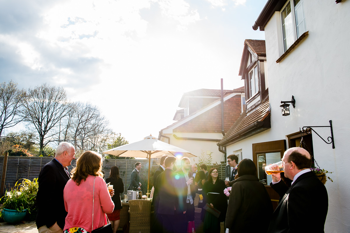 Guests relaxing at a surrey garden wedding