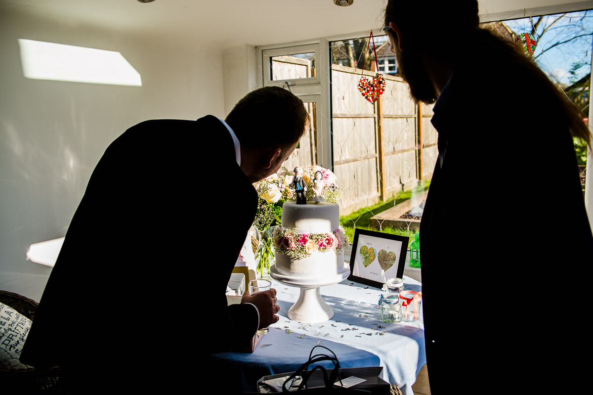 Guests looking at a wedding cake 