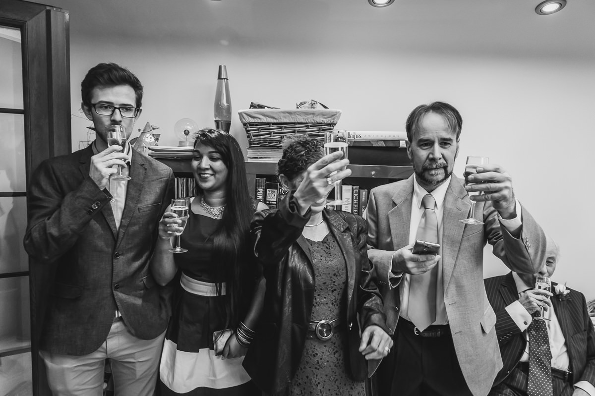 Guests toasting the newly weds at a surrey garden wedding