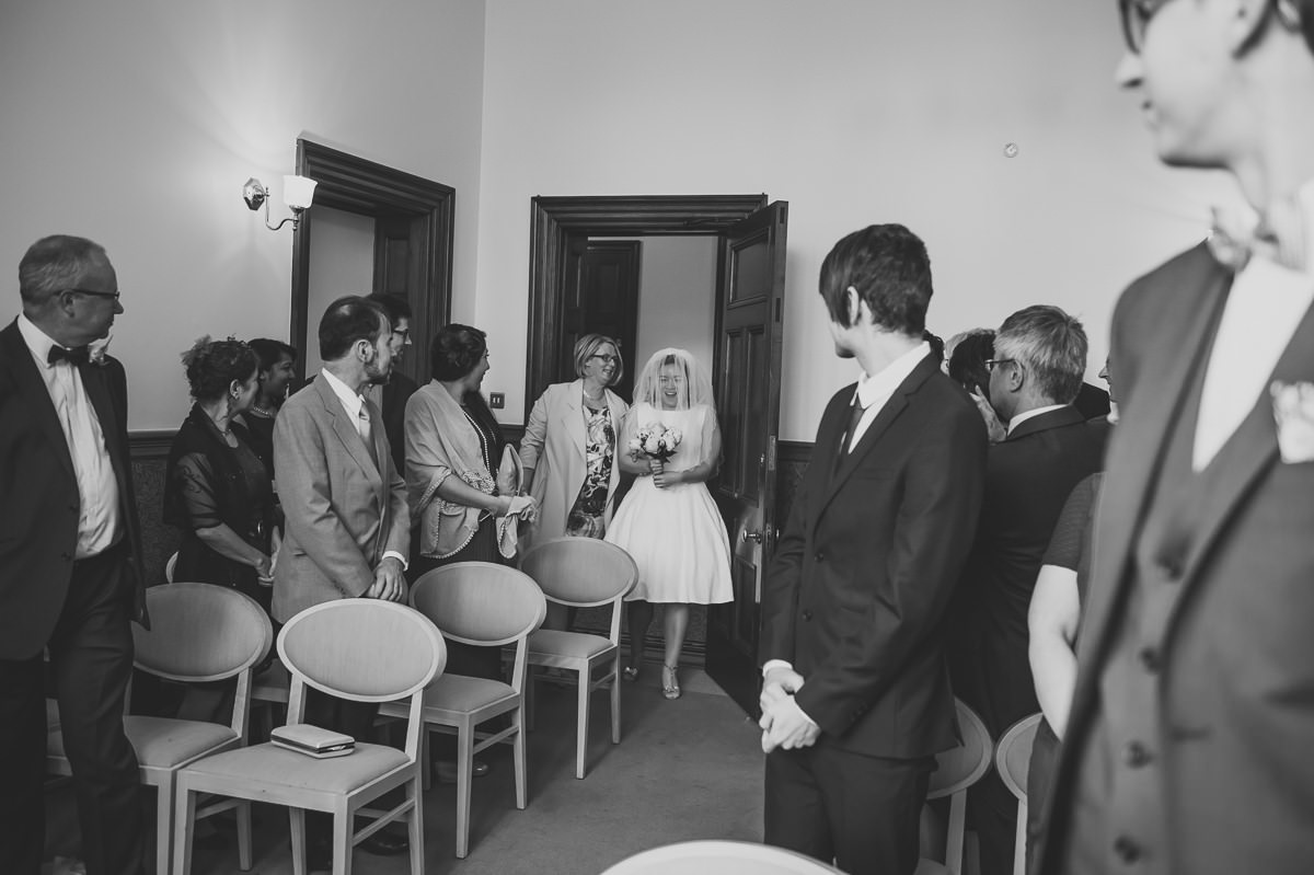 Bride enters the ceremony room at Croydon Registry office