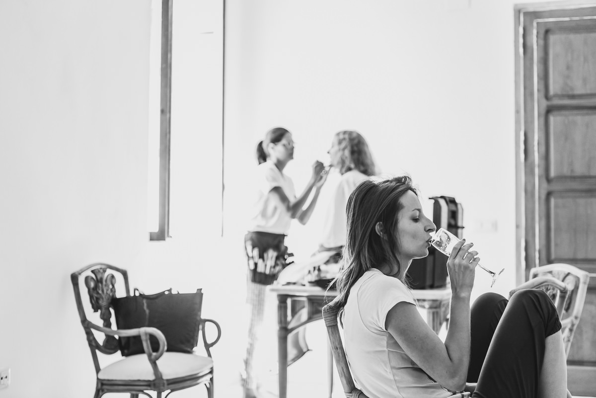 bride drinking champagne at casa santonja before her wedding
