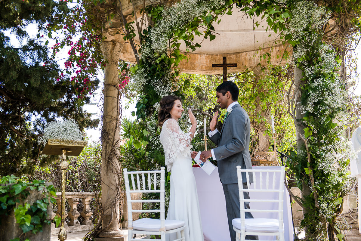 Bride and Groom high fiving at their Spanish wedding