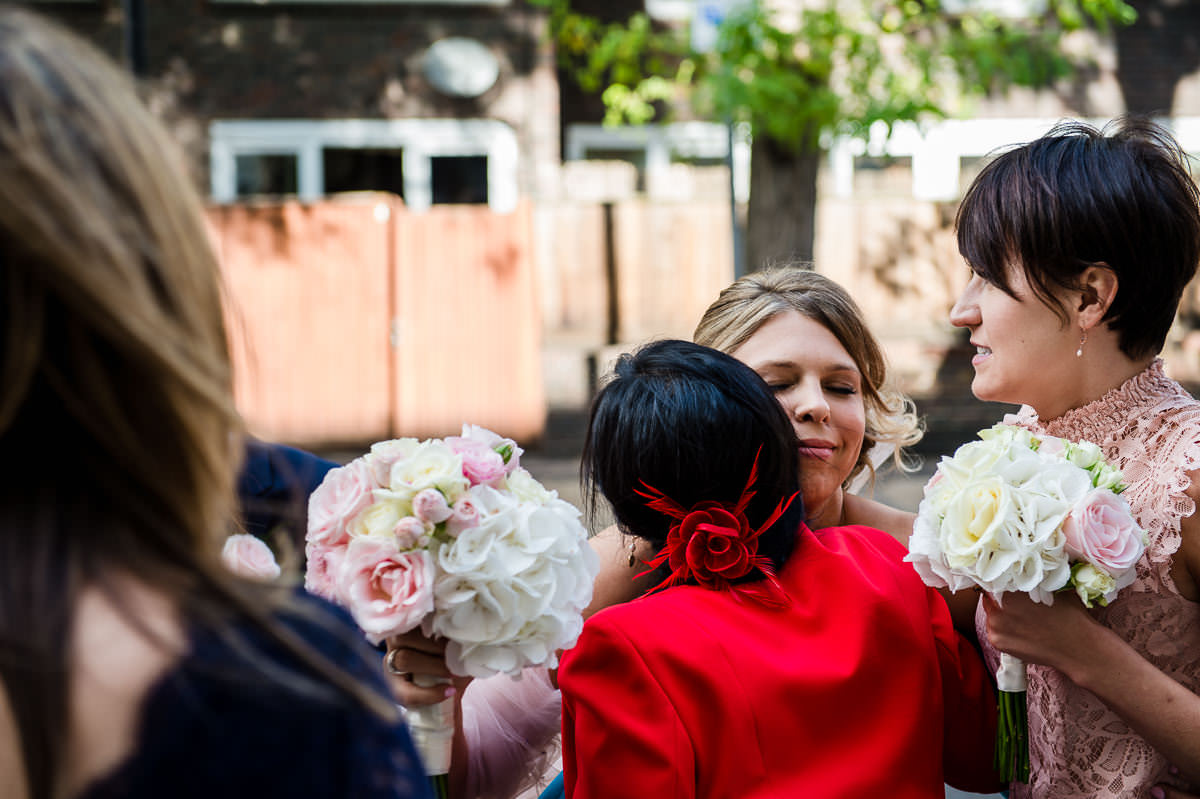 Town Hall Hotel wedding bride hugging wedding guest