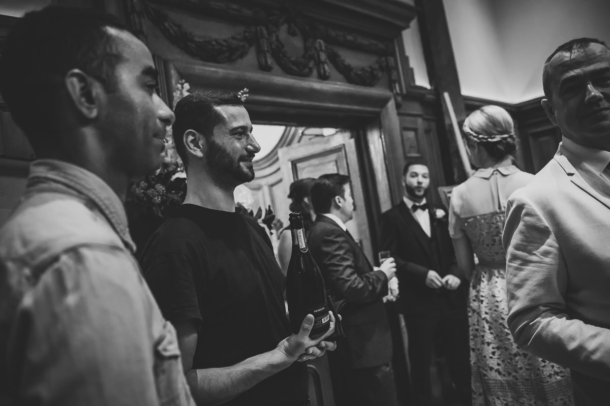 Town Hall Hotel wedding guests chatting and drinking champagne