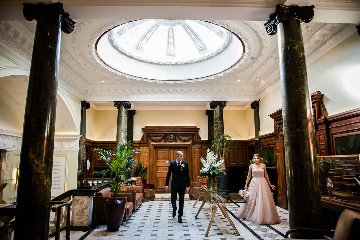 Bethnal Green Town Hall Hotel wedding bride and groom entering wedding breakfast room