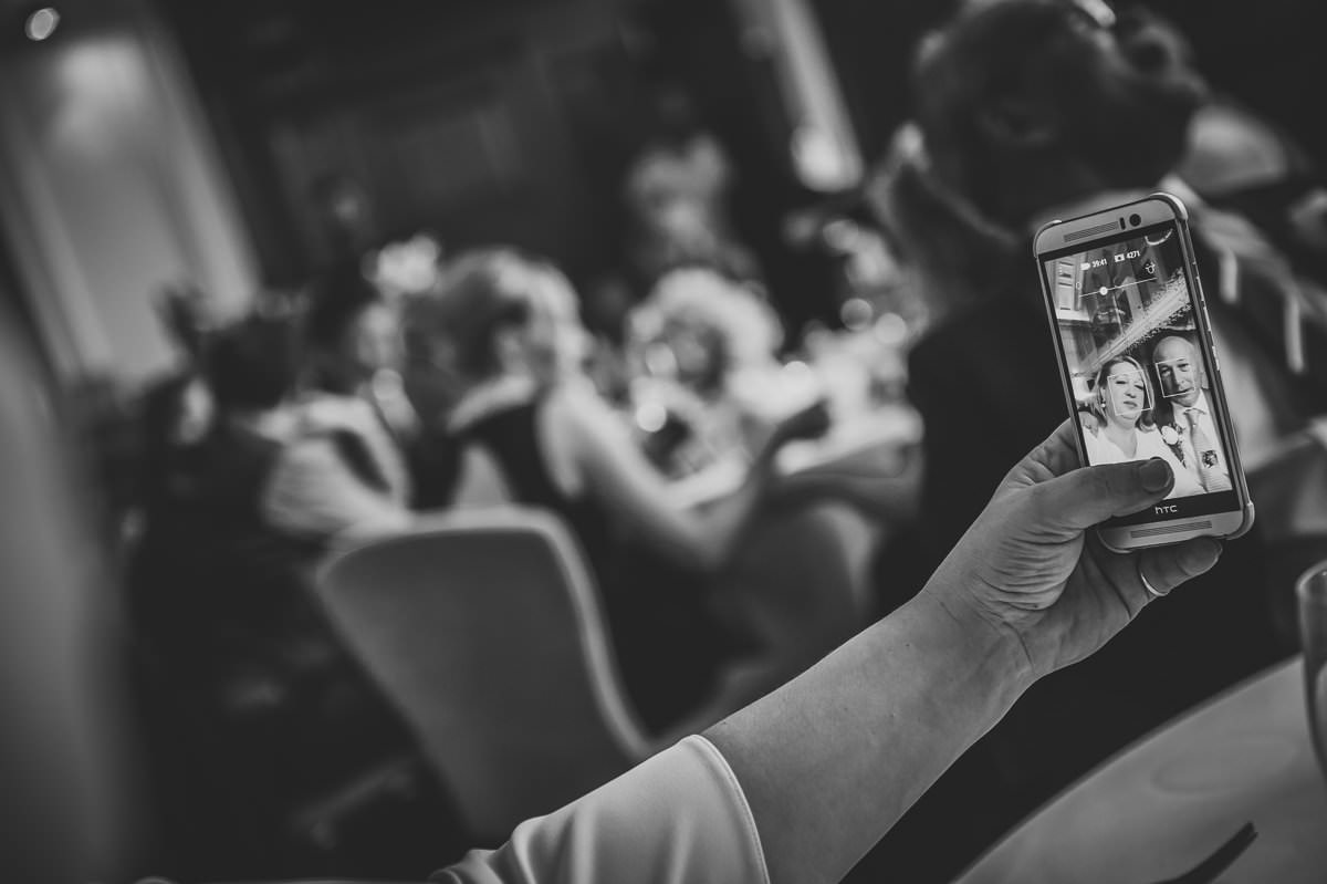 wedding guests taking selfies