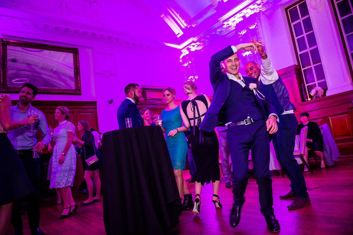 Groom and guests dancing