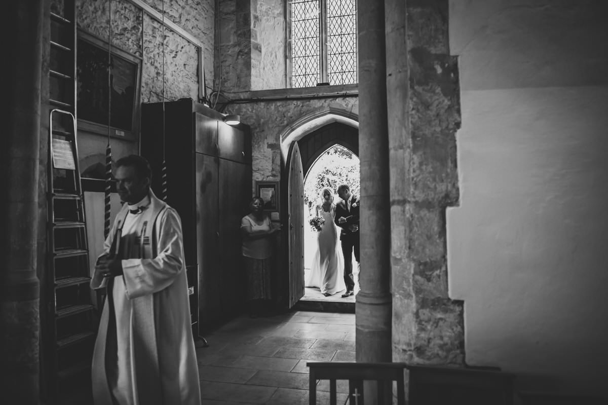 bride arriving at church with her dad ready for her wedding