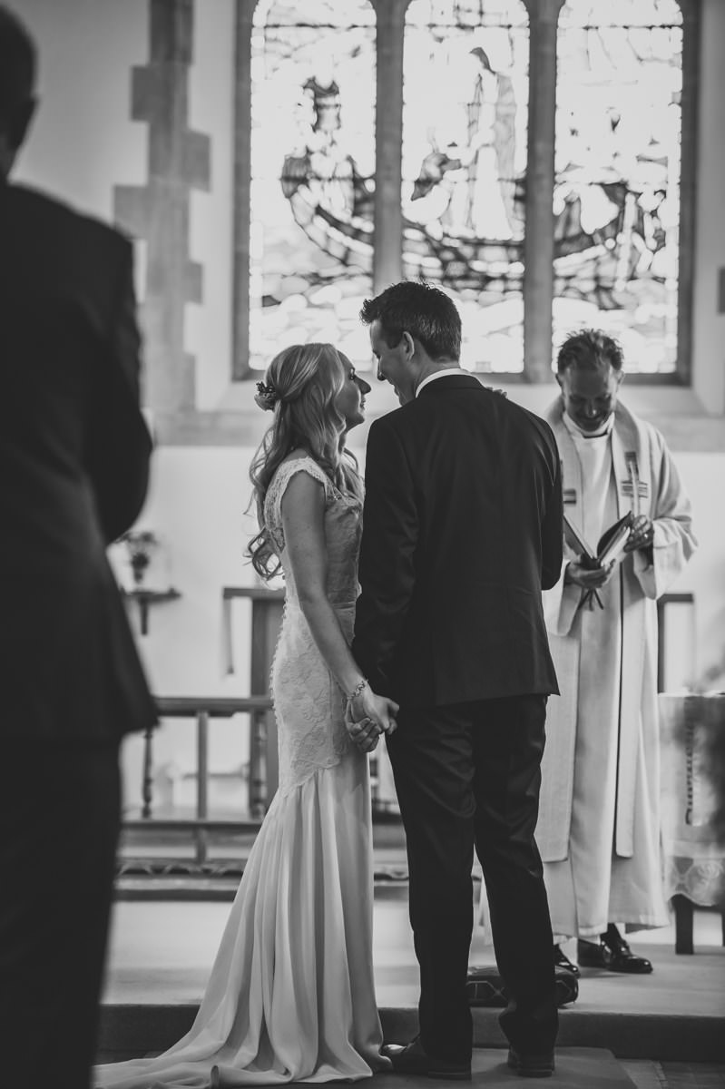 bride and groom looking lovingly at each other at their wedding