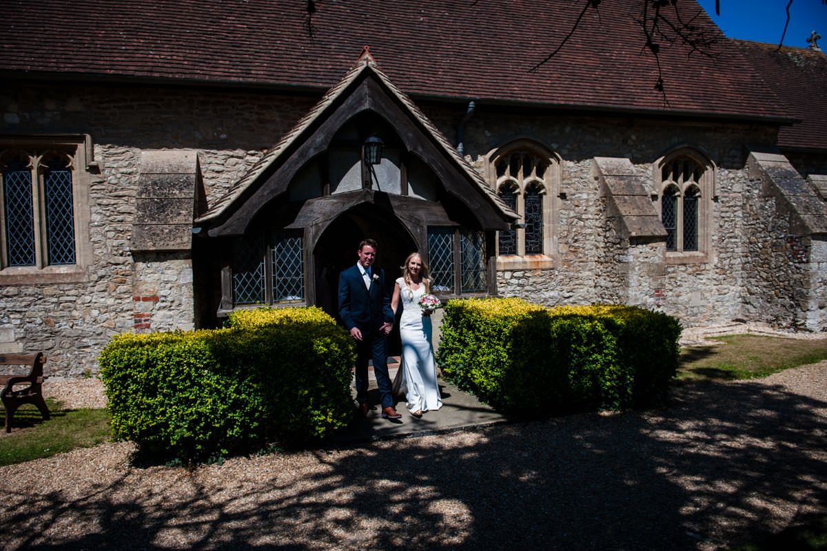 newly weds leaving church in west sussex