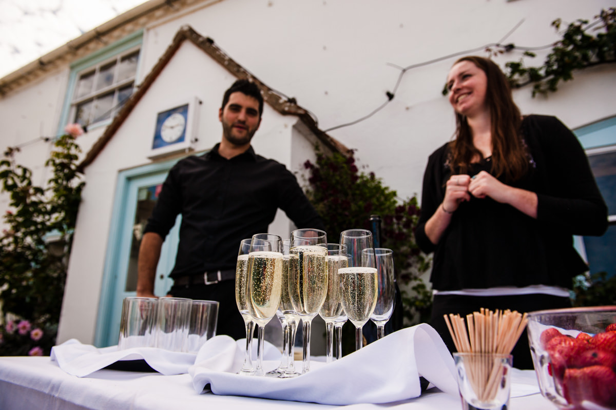 Champagne being served at a wedding at Itchenor Sailing Club