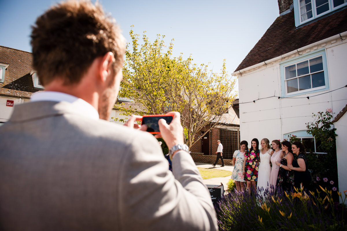 Photos being taken of guests at a wedding