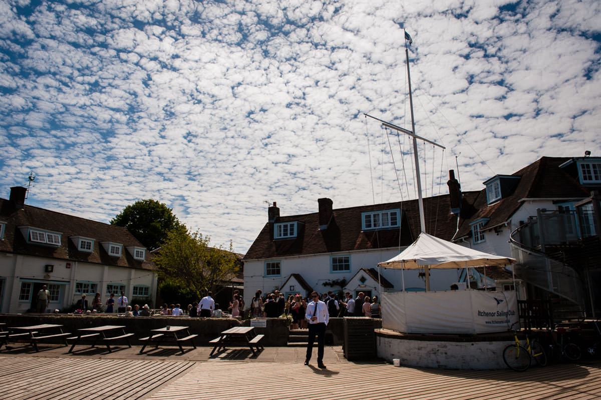Wide shot of Itchenor Sailing Club summer wedding