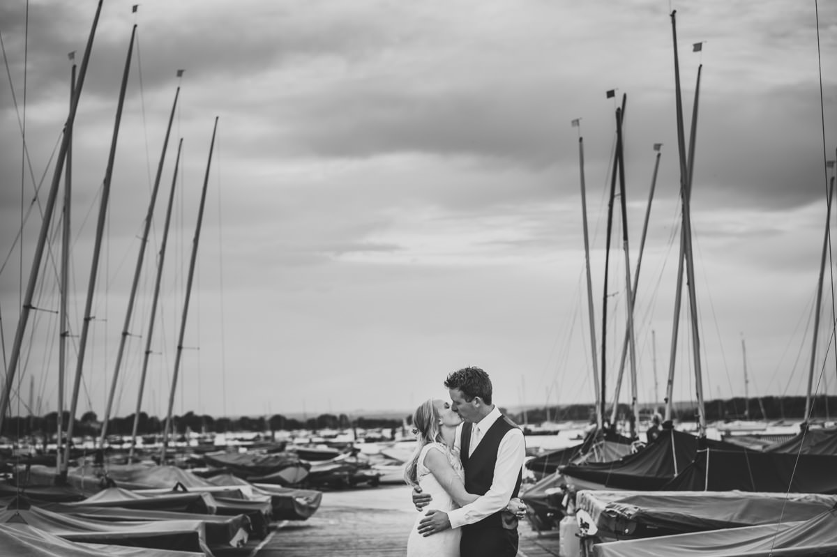 Bride and Groom kissing at their Itchenor Sailing Club wedding