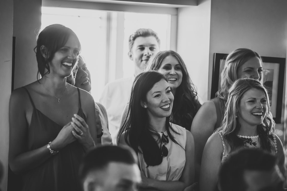 Guests listening to speeches at Itchenor Sailing Club wedding reception