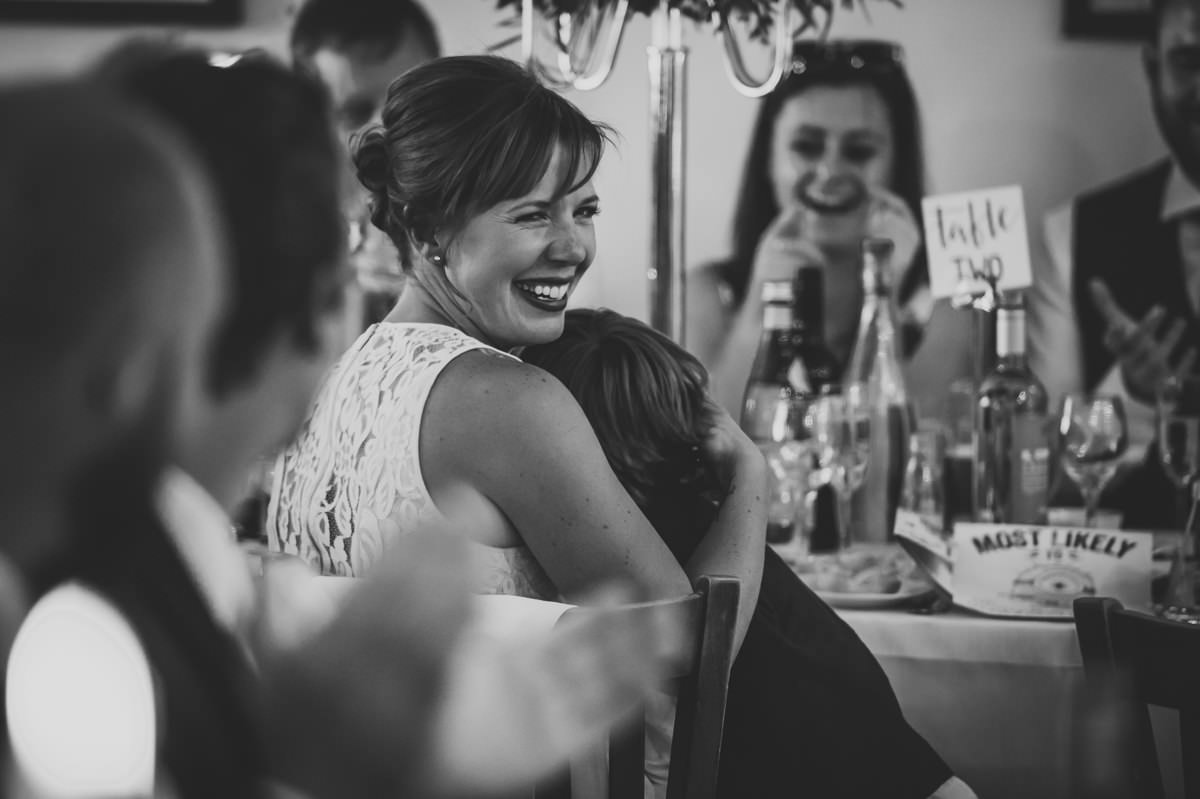 Guests laughing at wedding speeches