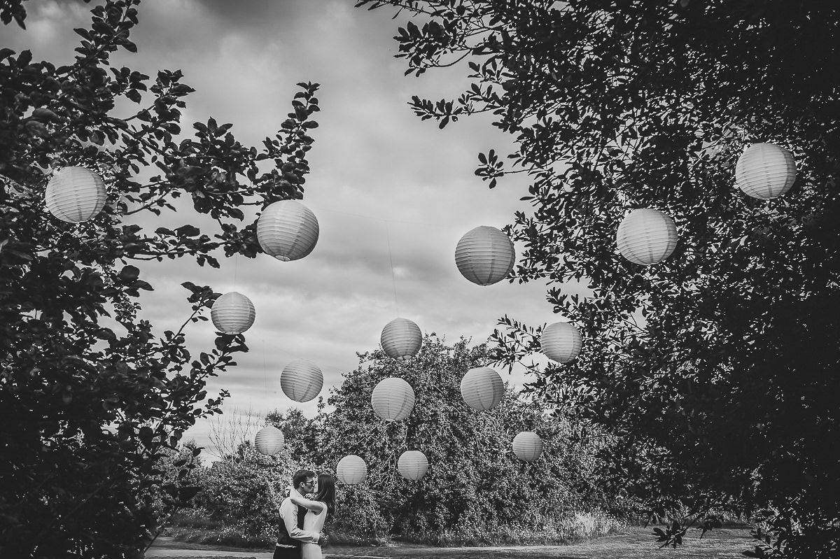 Bride and Groom kissing at their Somerset garden marquee wedding 