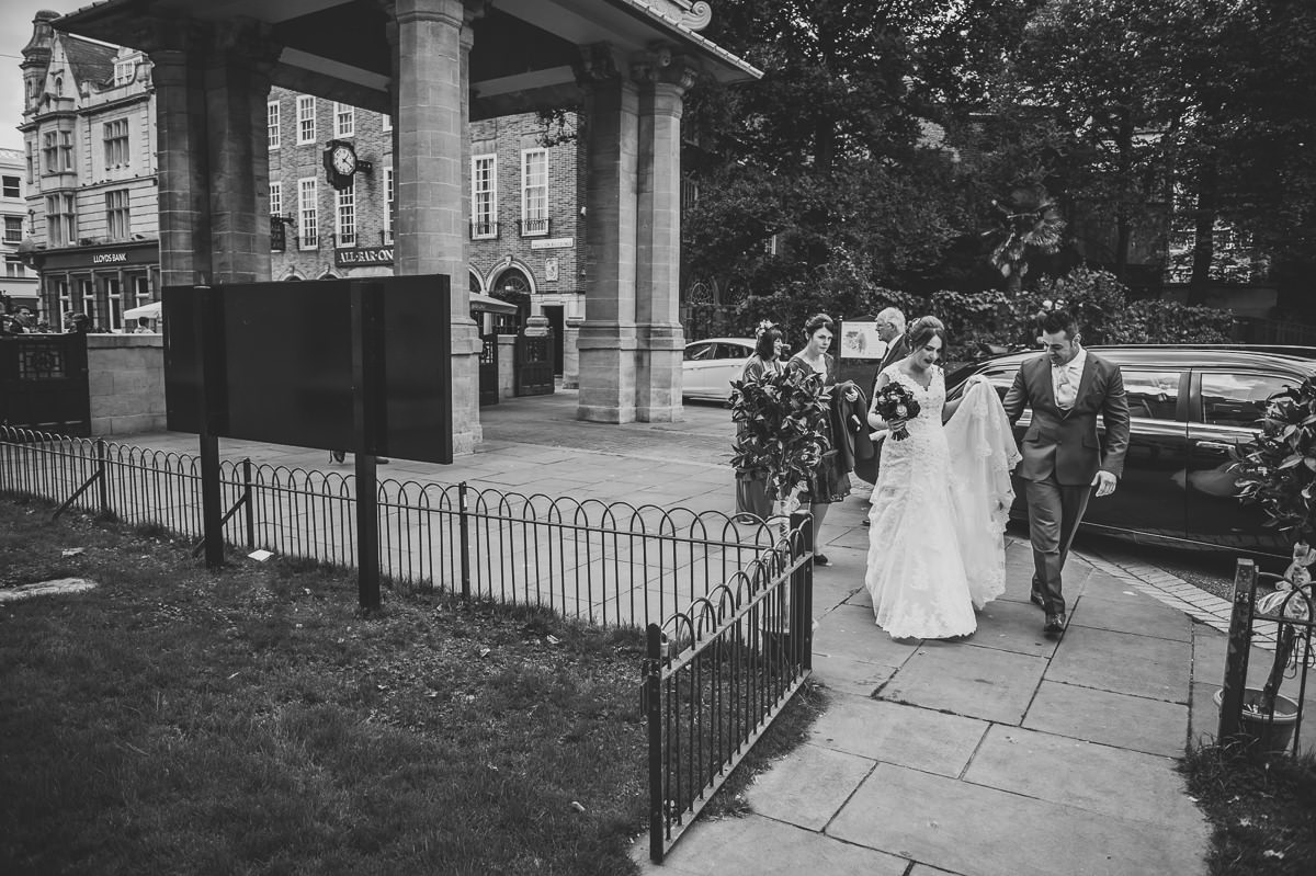 Bride and Groom going into the red drawing room at the royal pavilion for their wedding ceremony