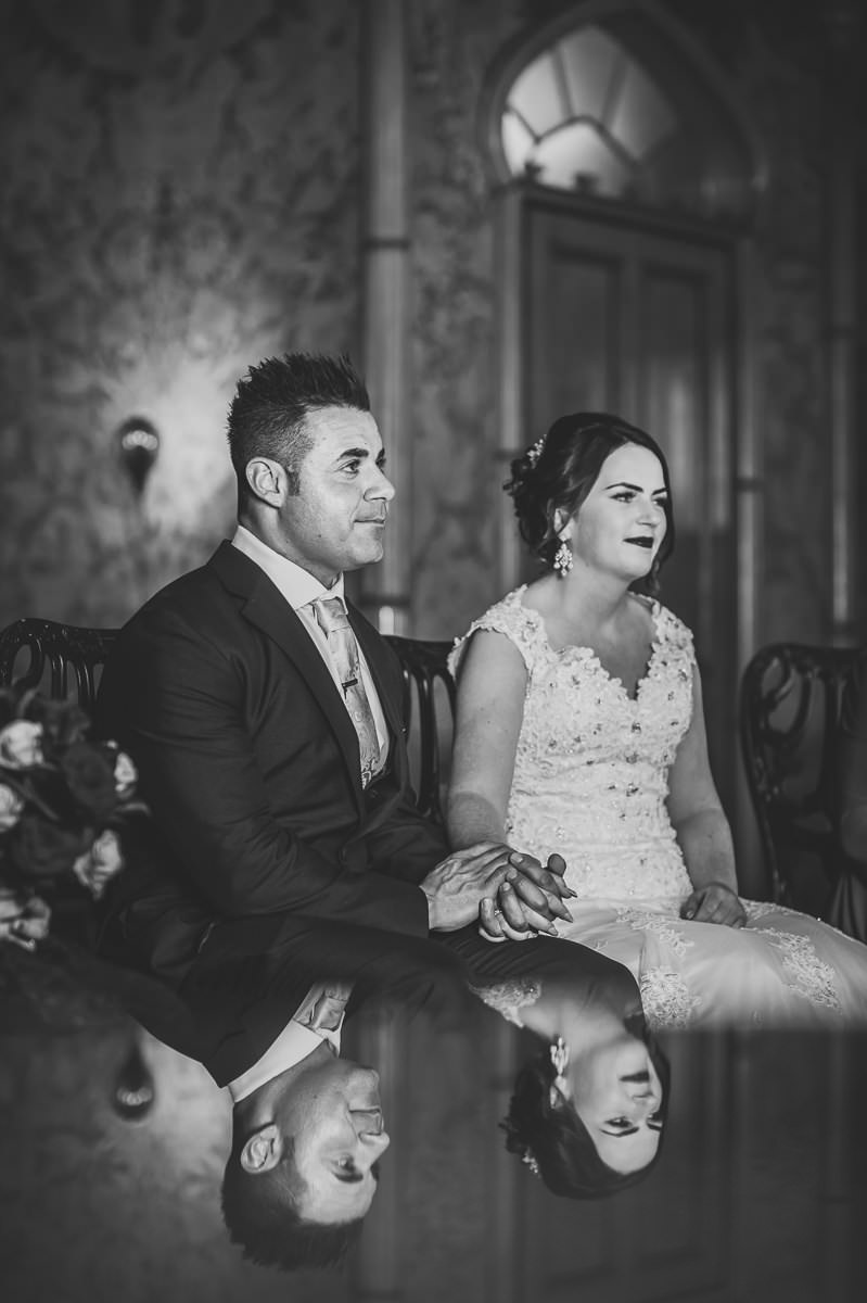 Simple reflection photo of bride and groom during their wedding ceremony