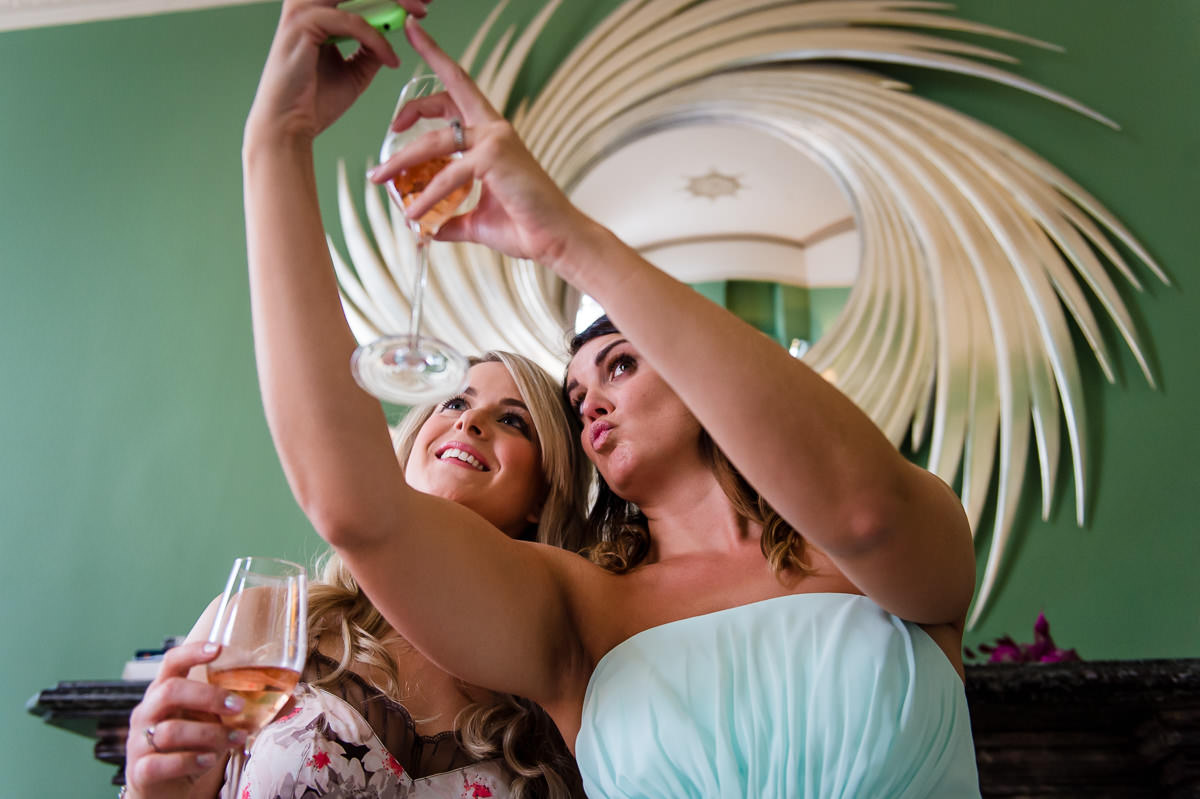 Bridesmaid and bride taking selfies!
