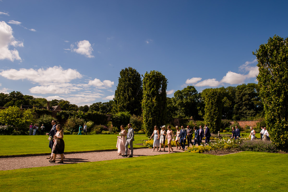 Wedding guests walking around Arley Hall & Gardens