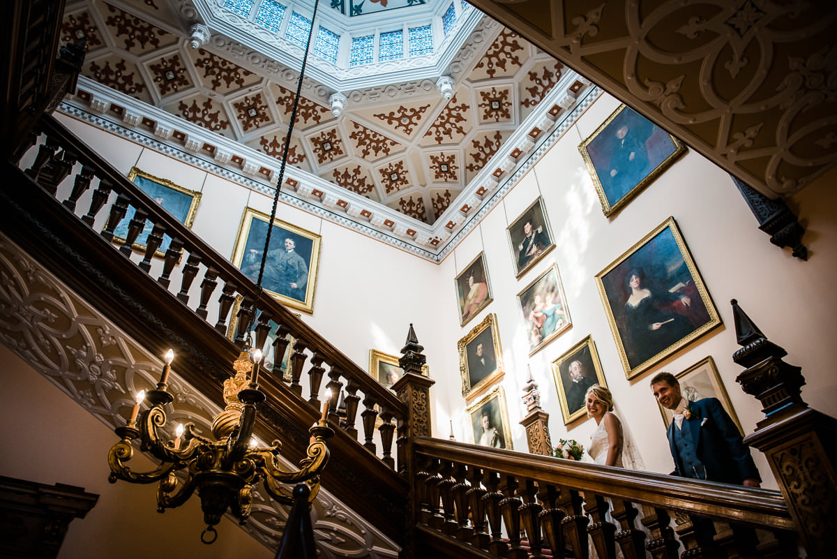 Newly Weds on the grand staircase at Arley Hall,Cheshire