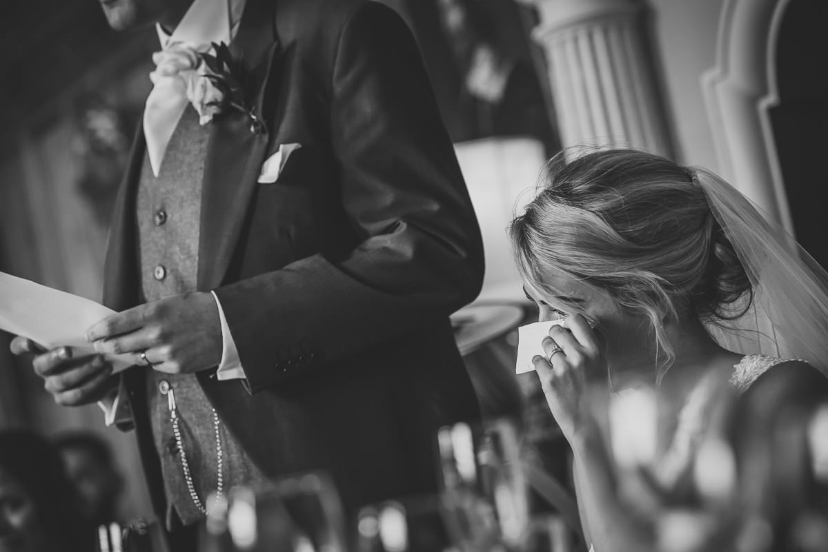 Bride shedding a tear during the Groom's speech at Arley Hall