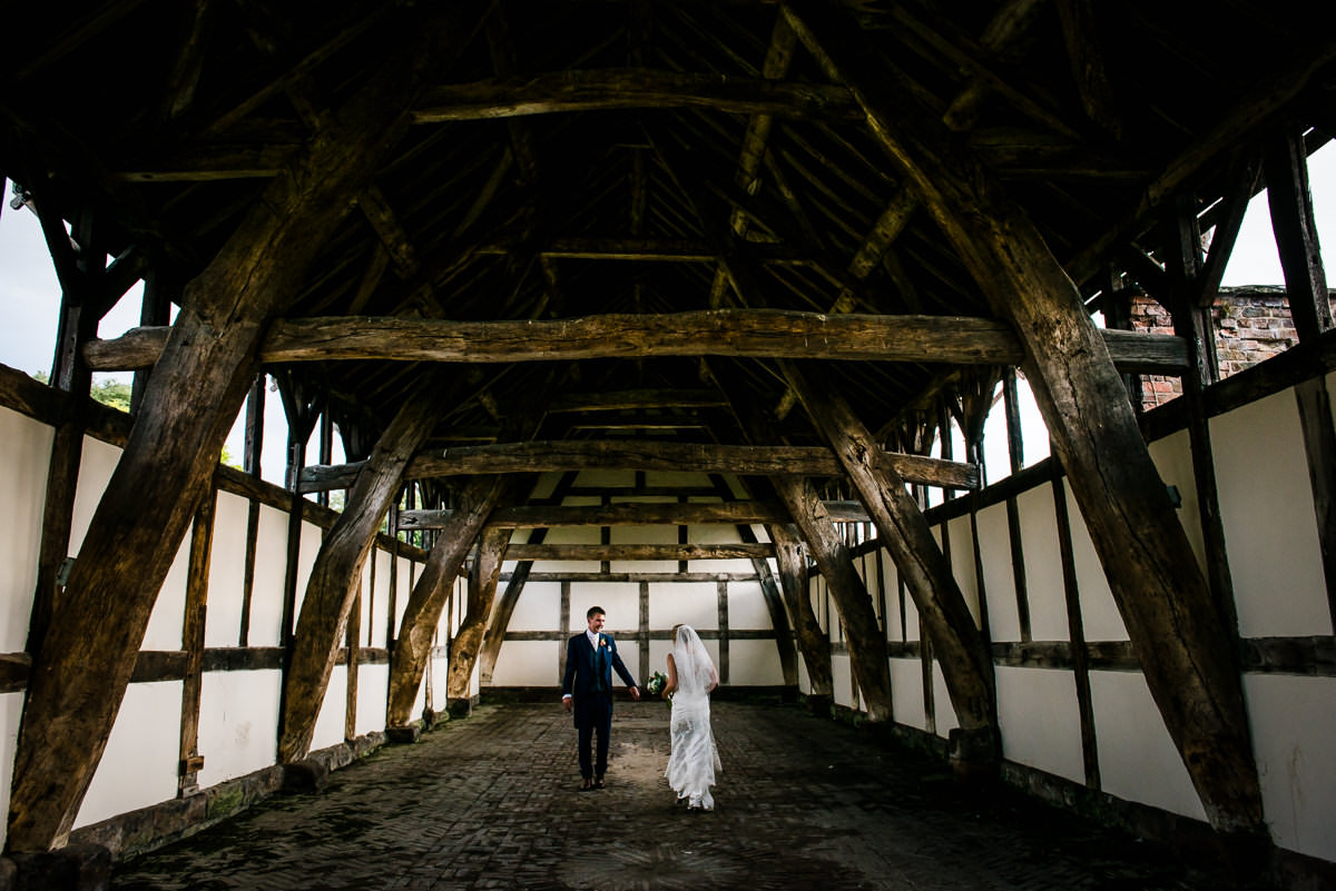 Bride & Groom in the old barn at Arley Hall