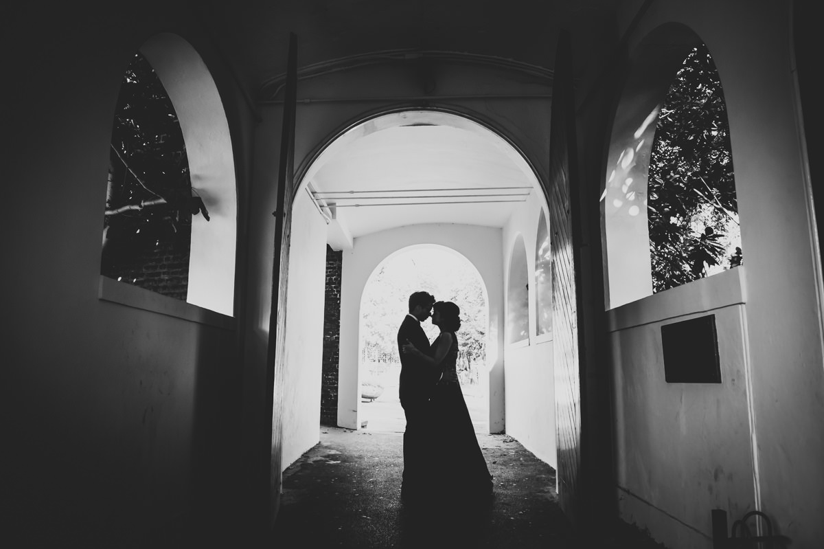 silhouette of a bride and groom kissing at the Orangery in Holland Park, London