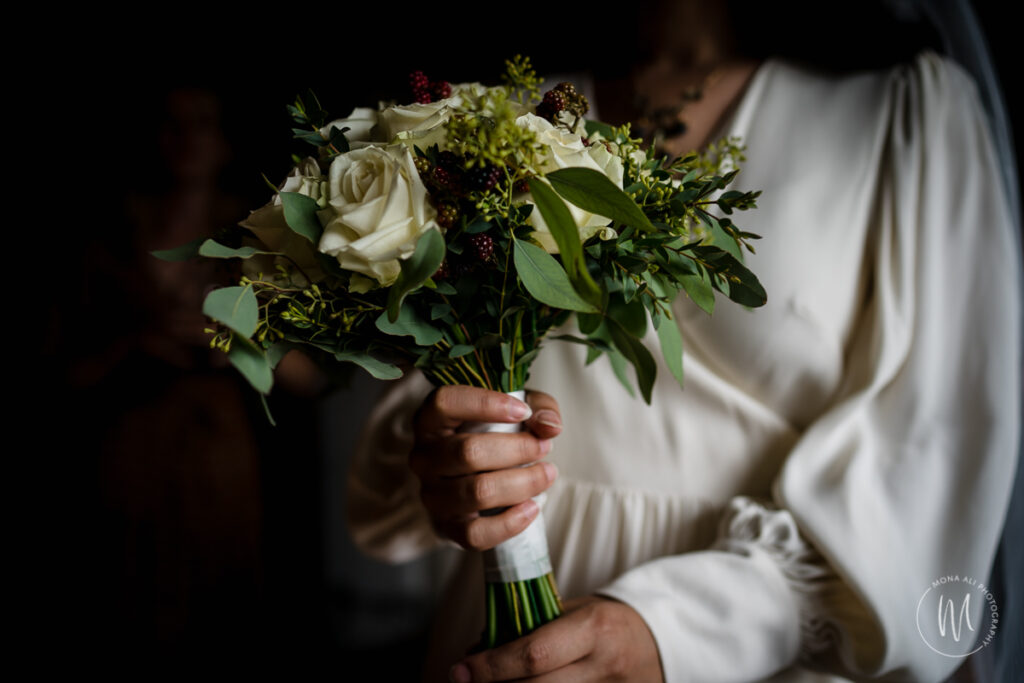 Bride in wedding dress with her bouquet of flowers