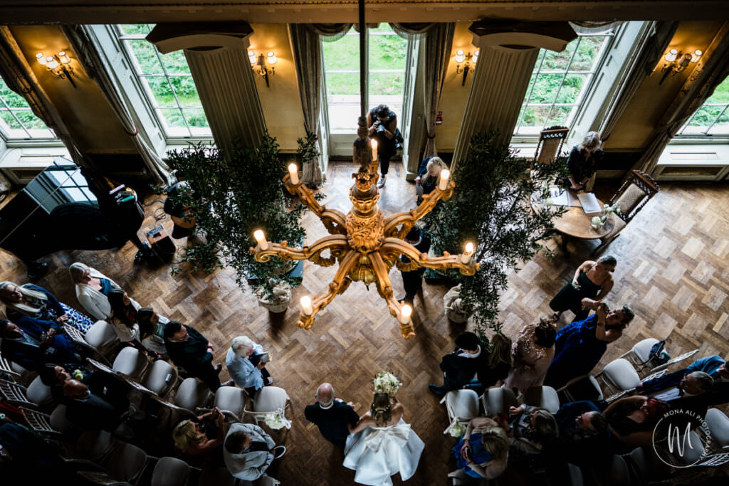 Bride making her entrance into the grand hall at Hampton Court House