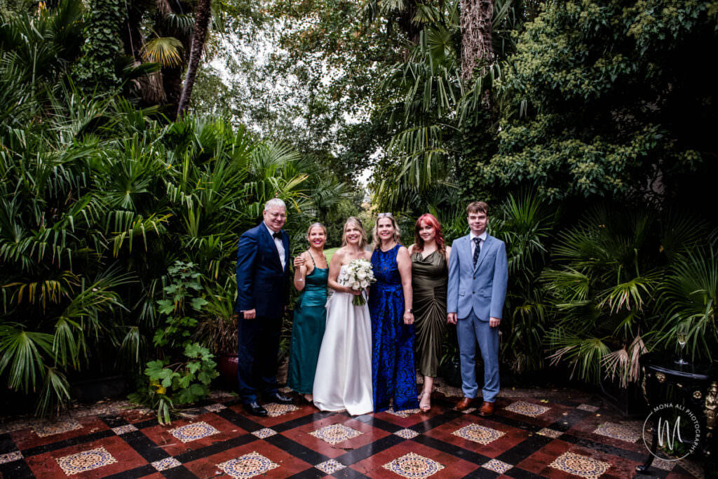 Group photos on the terrace at a Hampton Court House wedding